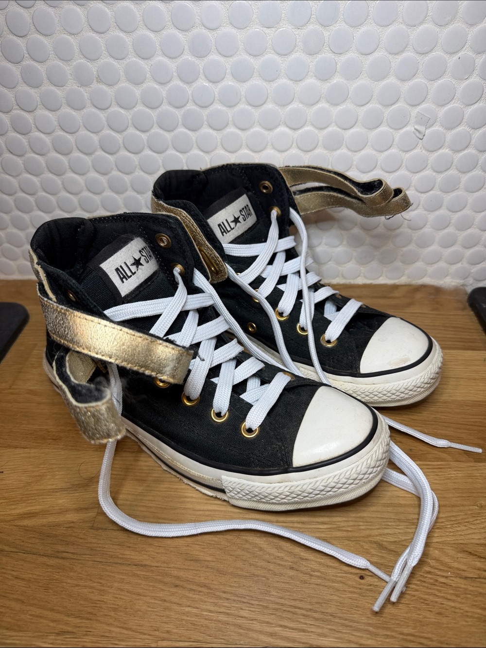 Converse Women’s Black High-Top Sneakers with Metallic Gold Strap